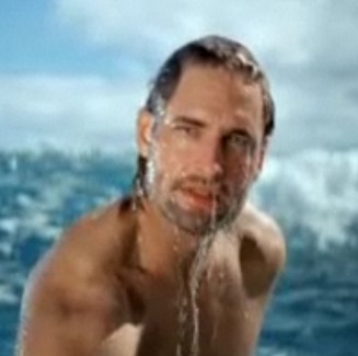 Josh Holloway, emerging from the ocean, in screenshot from TV commercial